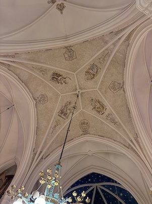 Painted vaulted ceiling inside Umeå City Church, seen from below