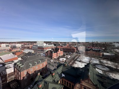 View over Umeå rooftops and red brick buildings in winter sun