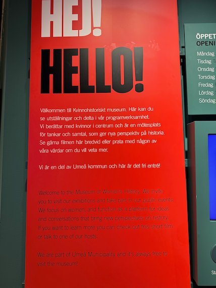 Red welcome sign Hej! Hello! at the Museum of Women’s History in Umeå