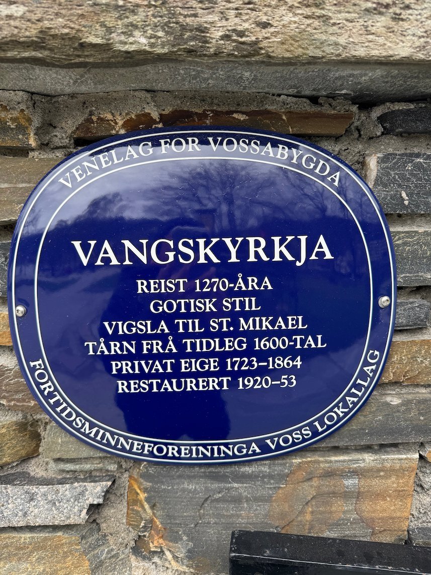 Blue plaque Vangskyrkja, built in the 1270s in Gothic style