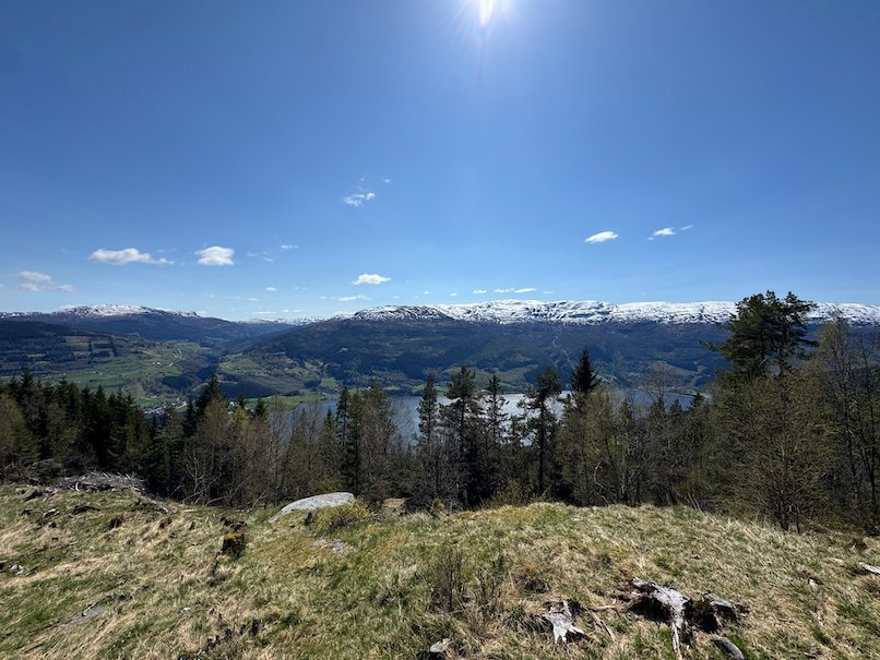 View from the hill at Dagsturhytta over Voss, the lake and the snowy mountains