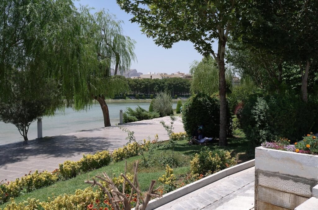 Riverbank with willow trees and flowers by the Zayandeh River