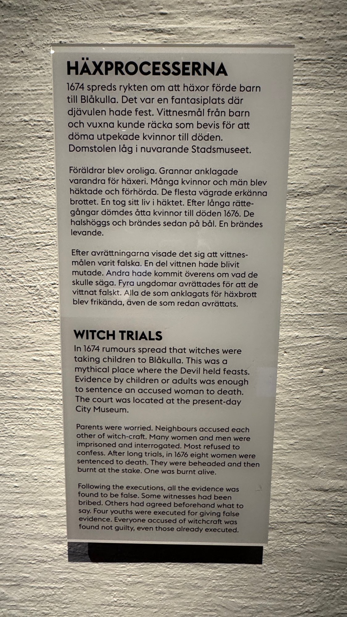 A text panel in Swedish and English about the witch trials in Stockholm in the 1670s at the Stockholm City Museum.