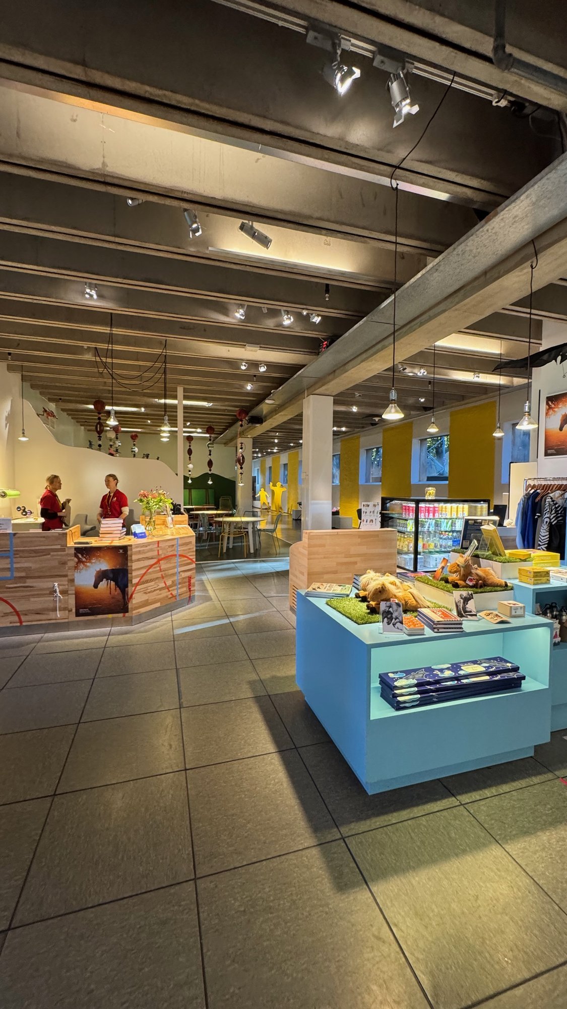 A bright exhibition hall with sports objects on display at Riksidrottsmuseet.