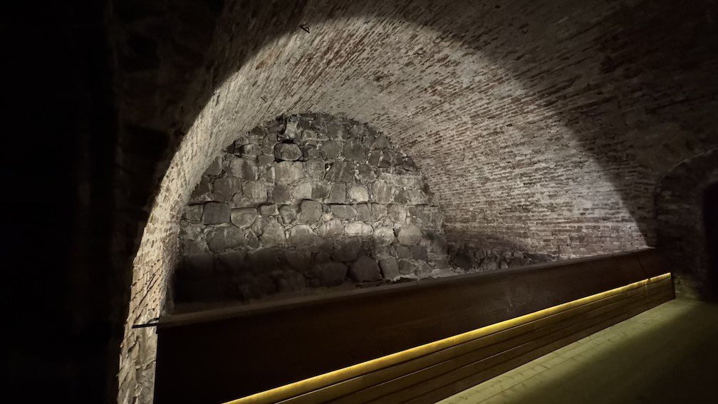 Vaulted brick and stone ceiling, part of the original 13th-century defense wall, at Museum Tre Kronor.