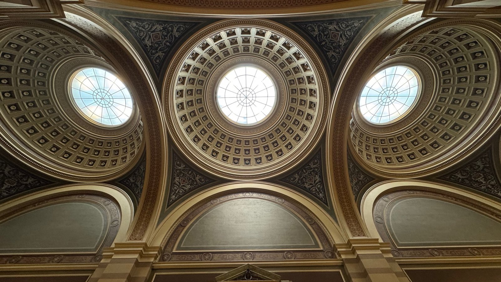 Domed ceiling with three round skylights in a Stockholm interior