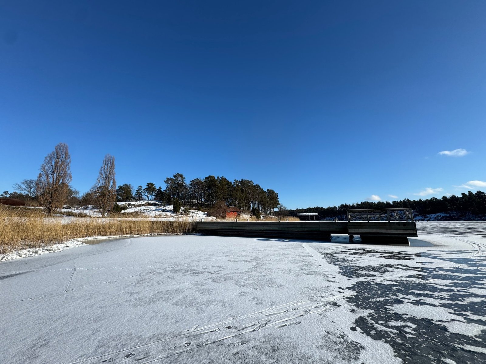 Bridge over a frozen lake in winter near Stockholm