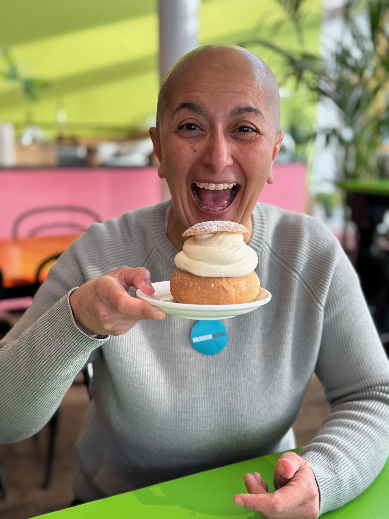 Zayera Khan holds up a semla bun during a Stockholm fika tour.