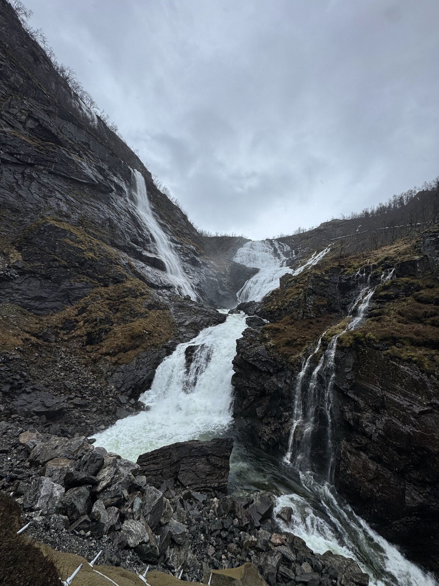 Two waterfalls rush down a rocky gorge.