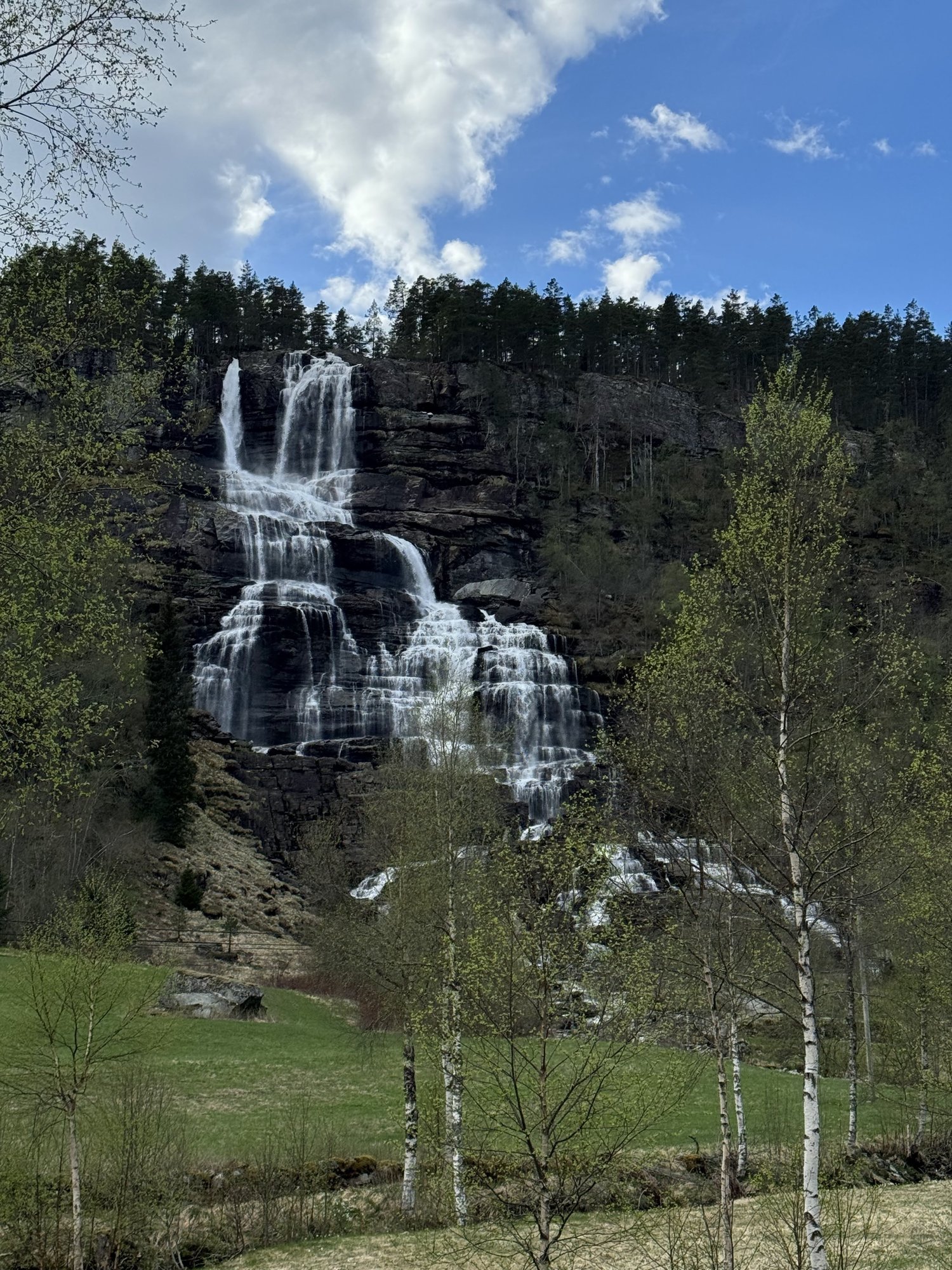 Tvindefossen waterfall falling down a dark rock wall near Voss Tvindefossen waterfall falling down a dark rock wall near Voss