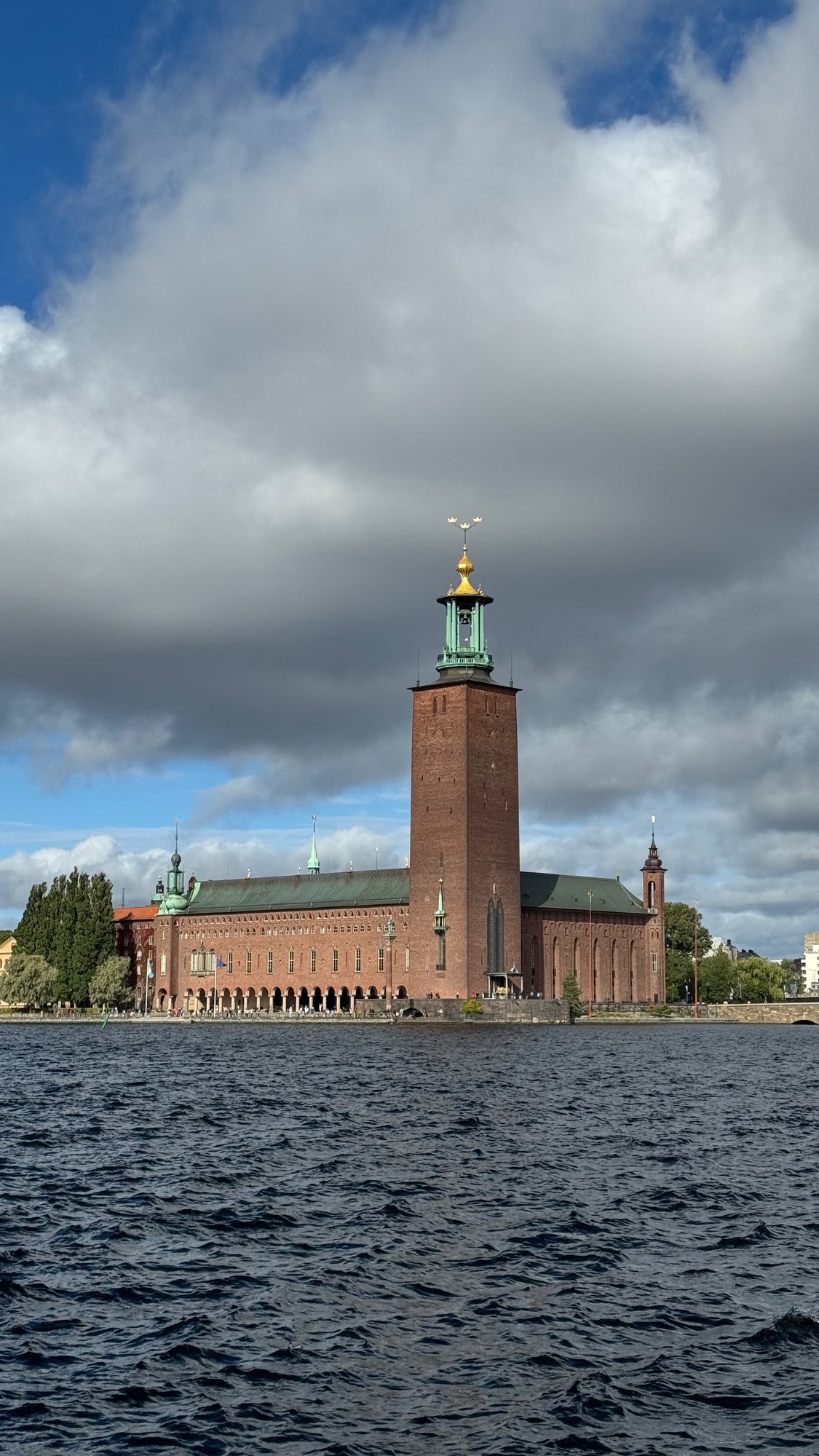 Stockholm City Hall tower under a dramatic sky
