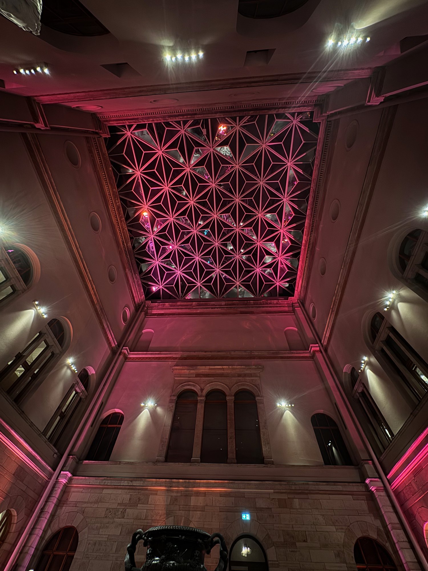 Museum ceiling lit in pink light, Stockholm