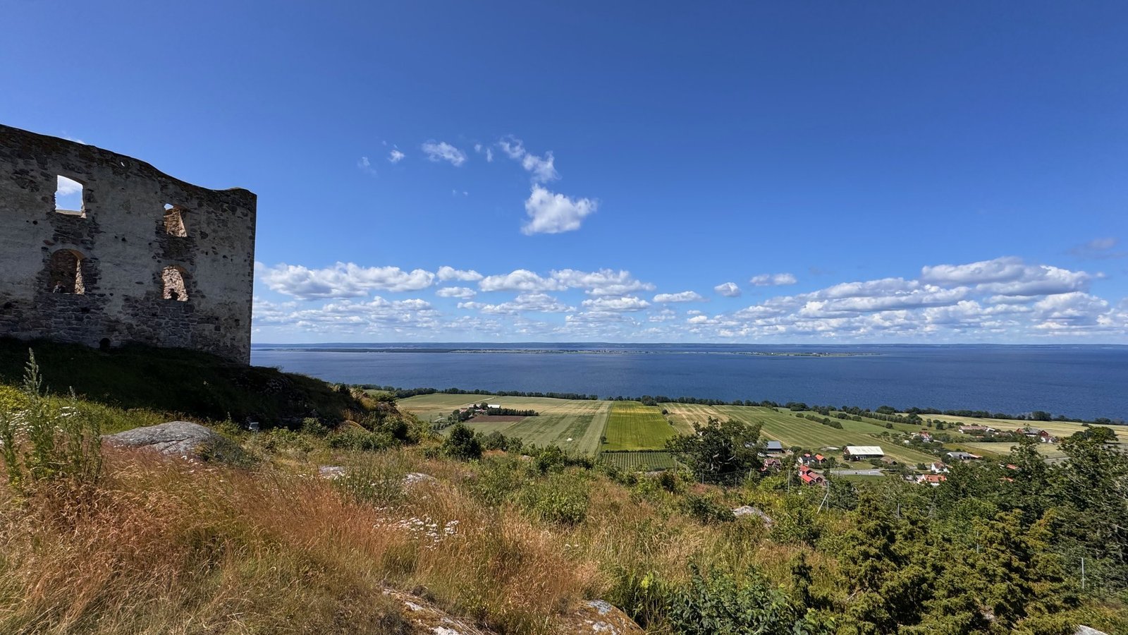 Brahehus castle ruins on the hilltop above lake Vättern
