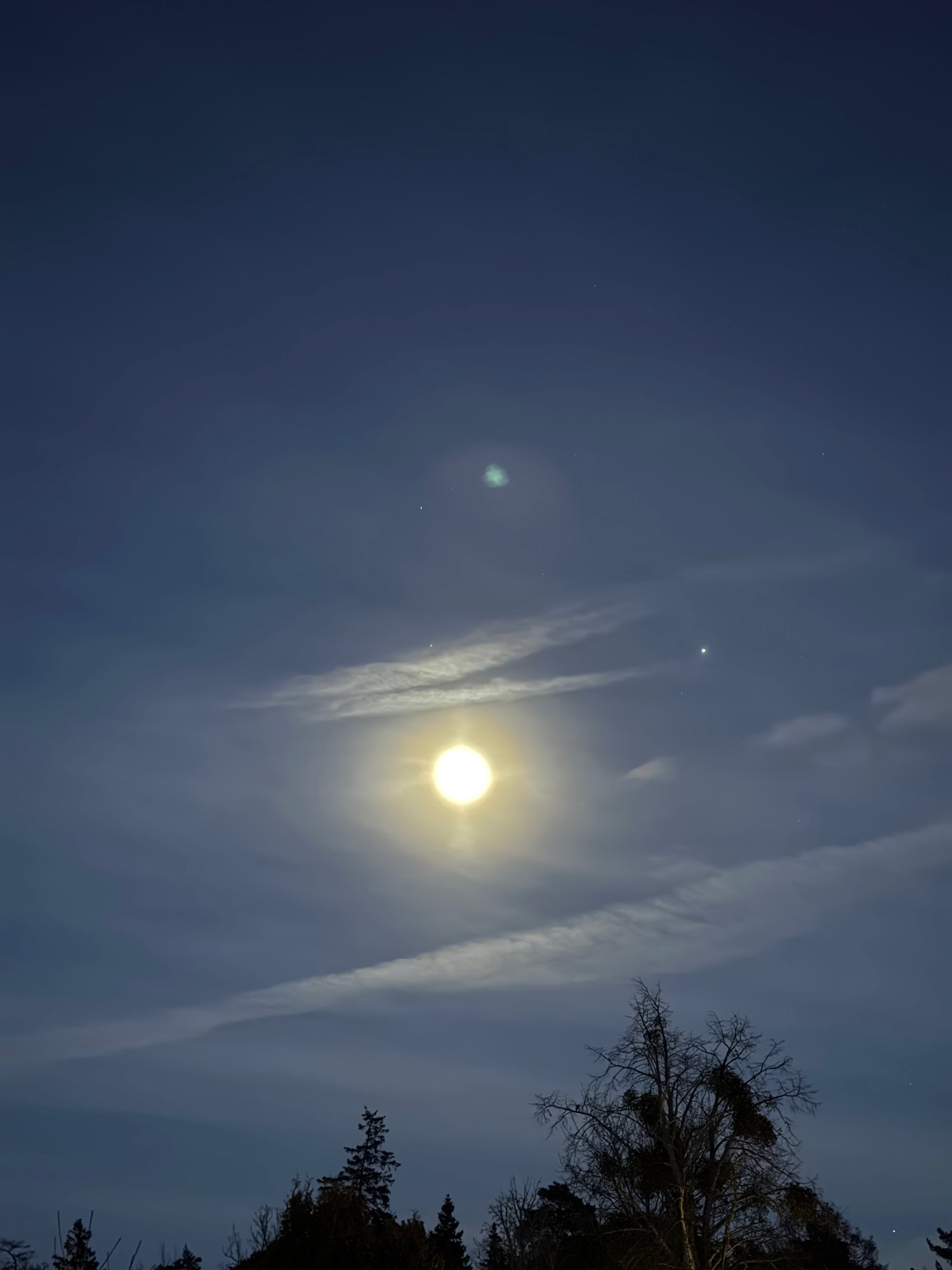 Moon halo in the night sky over Bro